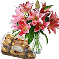 Order Online New Year Flowers to Secunderabad consisting 15 Pink Lily Vase, 16 Pcs Ferrero Rocher to Hyderabad