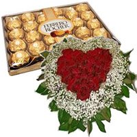 Midnight New Year Gifts to Hyderabad along with  24 pcs Ferrero Rocher with 50 Red Roses White Daisies Heart