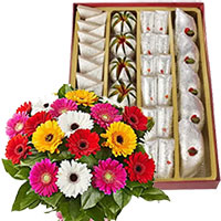 Order Online New Year Gifts to Hyderabad comprising 500 gm Assorted Kaju Sweets to Hyderabad with 12 Mix Gerbera Flowers in Hyderabad