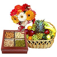 New Year Gifts to Hyderabad Same Day Delivery having of Bunch of 12 Mix Gerberas with 3 kg Fresh fruit Basket and 0.5 kg Mixed Dry fruits