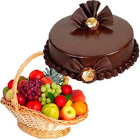 Send Diwali Gifts to Hyderabad. 1 Kg Fresh Fruits to Hyderabad in Basket with 500 gm Chocolate Truffle Cakes Hyderabad