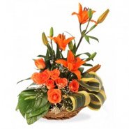 Order Online Friendship Day Flowers with 3 Orange Lily 6 Orange Roses Basket 12 Flowers to Hyderabad