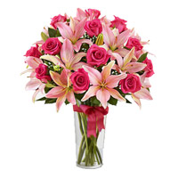 Order Online Flower Delivery in Hyderabad. 4 Pink Lily 15 Pink Rose in Vase on Rakhi