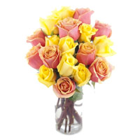 Order Christmas Flowers Online contains Yellow Pink Roses Vase 15 Flowers in Hyderabad