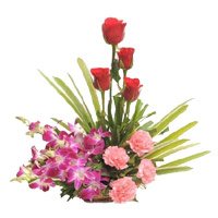 Orchids, Roses, Carnation Basket 12 Flowers. Same Day New Year Flowers to Hyderabad