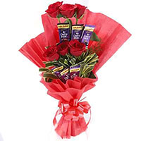 Order New Year Gifts to Hyderabad containing 16 Pcs Ferrero Rocher 24 Red White Roses Flowers Bouquets to Vijayawada