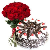 New Year Cake in Vishakhapatnam Online incorporated 24 Red Roses with 1 Kg Black Forest Cake