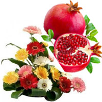 Online New Year Fresh Fruits to Hyderabad. Mixed Gerbera Basket of 15 Flowers in Hyderabad with 1 Kg Fresh Promegranate